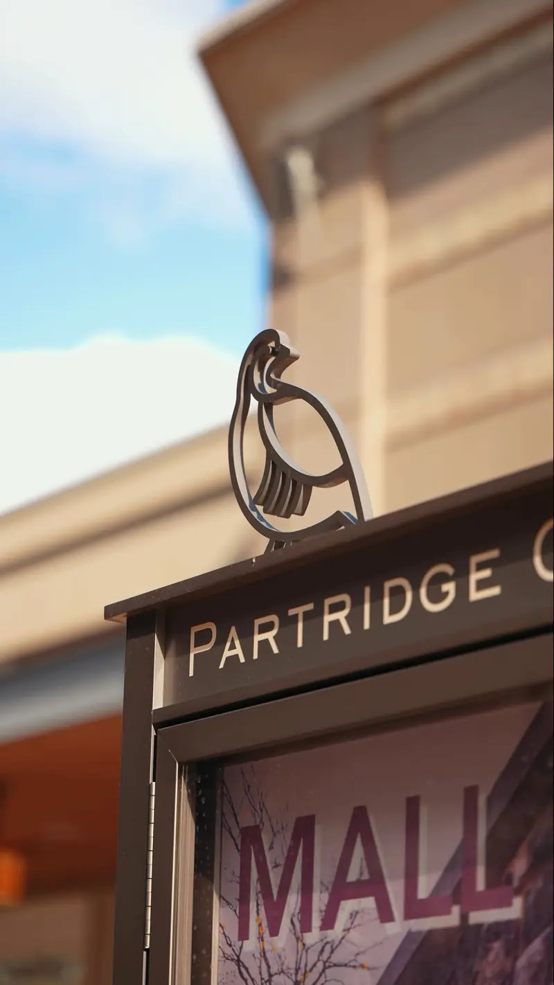 The Mall at Partridge Creek sign with the partridge emblem, Clinton Township