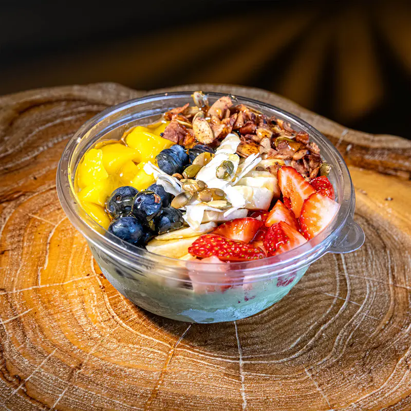Matcha açaí bowl with mango, blueberries, strawberries and granola