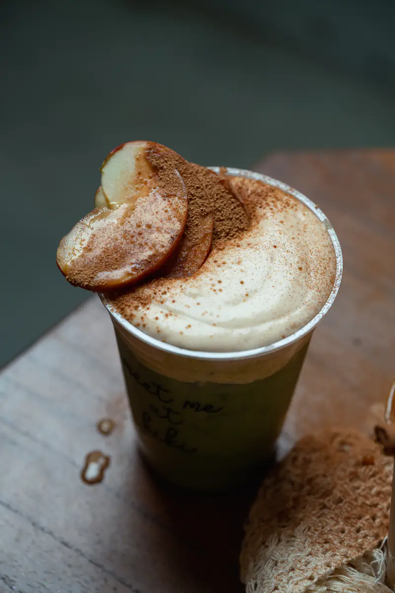 Matcha with caramelized apple and cinnamon in a meet me at kiki cup